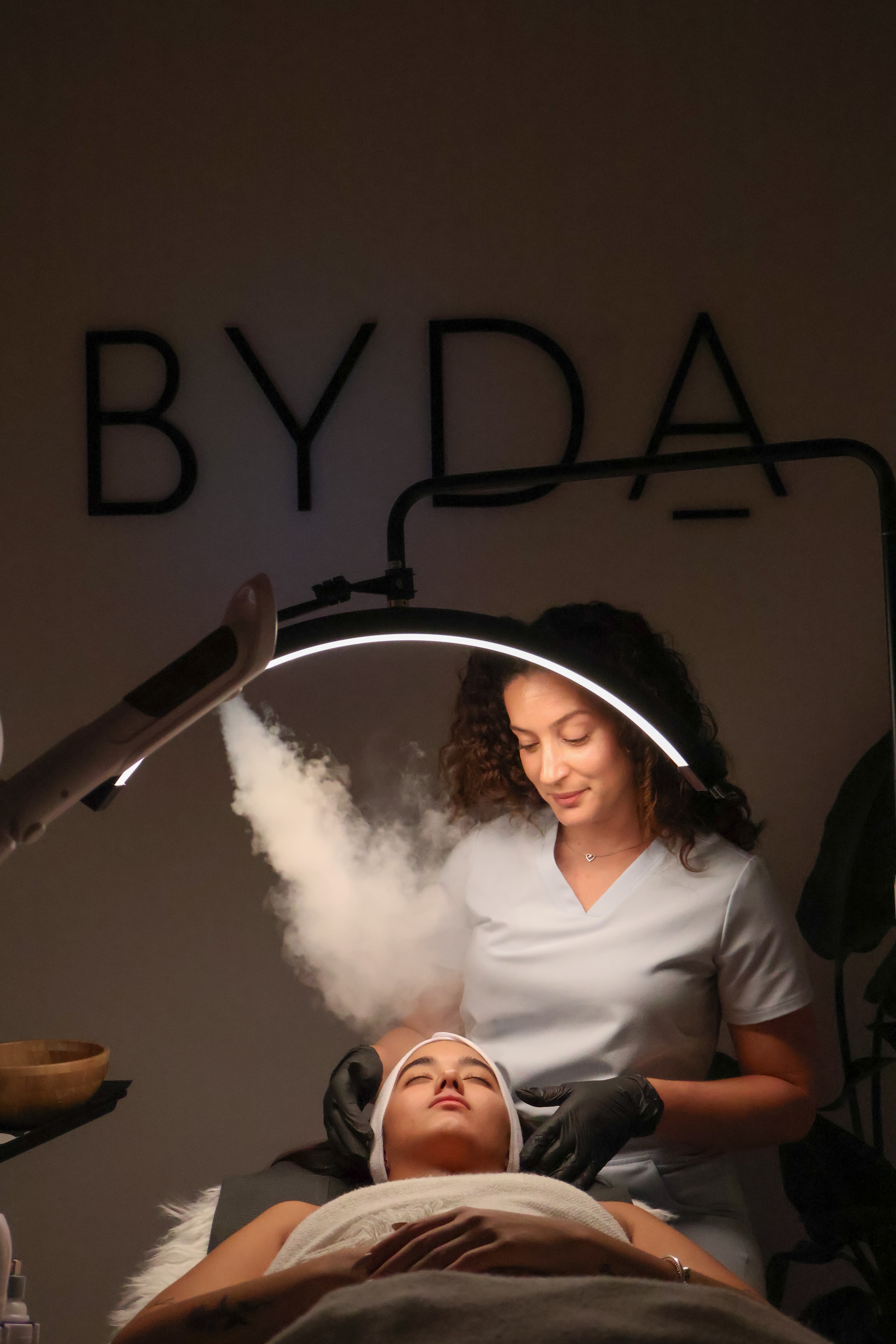 Esthetician performing a facial treatment
